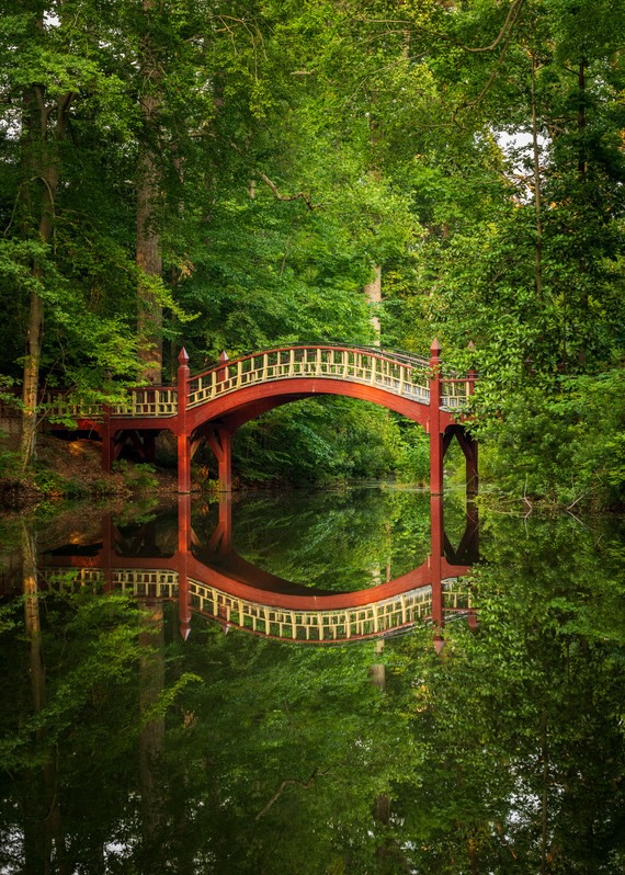 Crim Dell Bridge at the College of William and Mary, reflected in the surrounding wooded pond